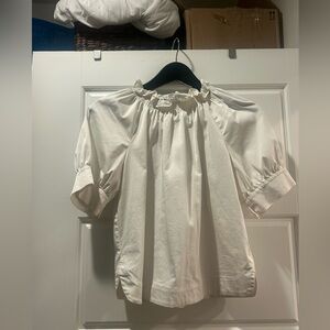 White ruffle blouse